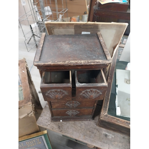 592 - 19th C. scumbled pine shop cabinet with two short drawers over three long drawers with carved wooden... 