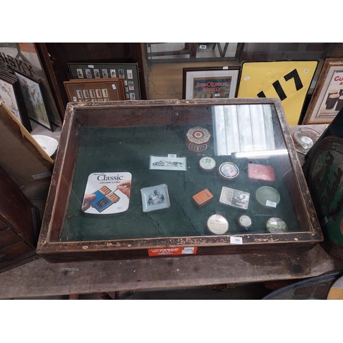 594 - Early 20th C. mahogany and glass counter display cabinet. {20 cm H x 92 cm W x 65 cm D}.