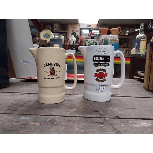 608 - Bushmills Irish Whiskey water jug {13 cm H x 12 cm W  x 7 cm D} and Jameson Irish Whiskey water jug ... 