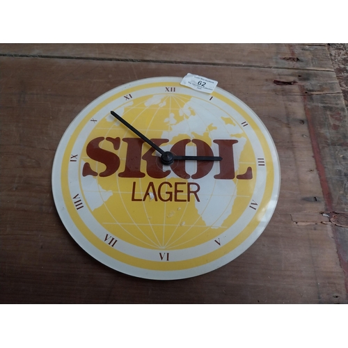 62 - SKOL Perspex advertising battery clock. {20 cm H x 22 cm W}.