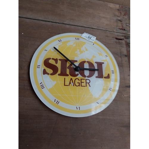 62 - SKOL Perspex advertising battery clock. {20 cm H x 22 cm W}.