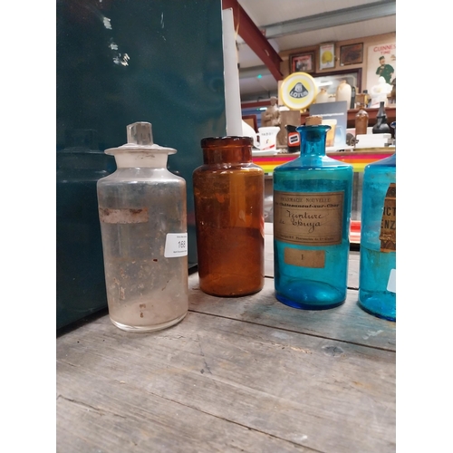 625 - 19th C. miscellaneous lot of seven blue, brown and clear chemist bottles. {23 cm H x 7 cm Dia to 14 ... 