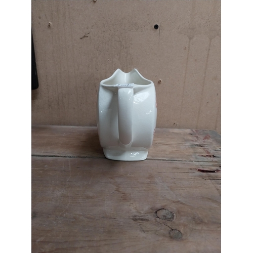 63 - Tennents Lager and Stout ceramic advertising water jug. {12 cm H x 16 cm W x 9 cm D}