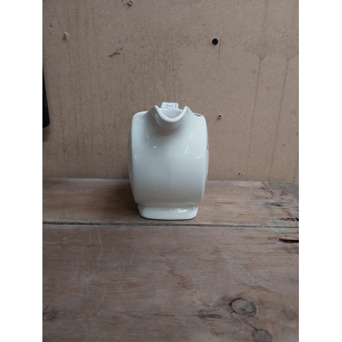 63 - Tennents Lager and Stout ceramic advertising water jug. {12 cm H x 16 cm W x 9 cm D}