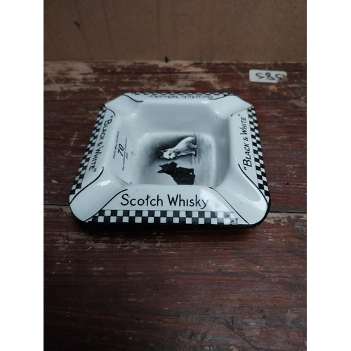 70 - Black and White Scotch Whiskey advertising ashtray {3 cm H x 12 cm W x  12 cm D}.