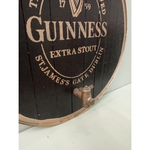 717 - Guinness Extra Stout brass strapped barrel end with tap  Dia 60cm . NOT AVAILABLE TO VIEW IN PERSON.