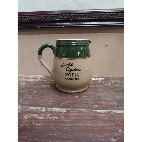 72 - Ogden's Robin cigarettes advertising jug {14cm H x 15cm W x 10cm D}.