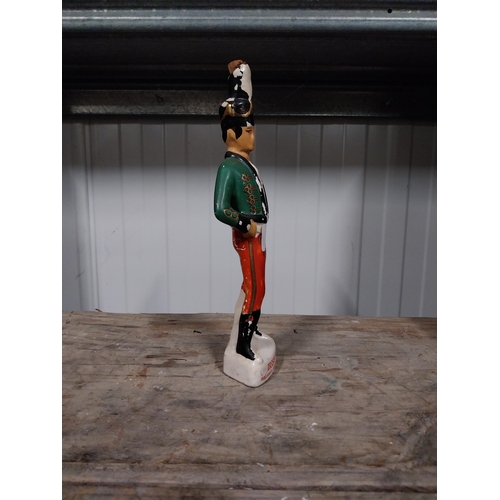 724 - Irish Mist ceramic advertising figure. {27 cm H x 4 cm Dia}.