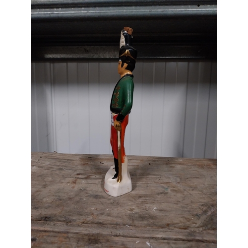 724 - Irish Mist ceramic advertising figure. {27 cm H x 4 cm Dia}.