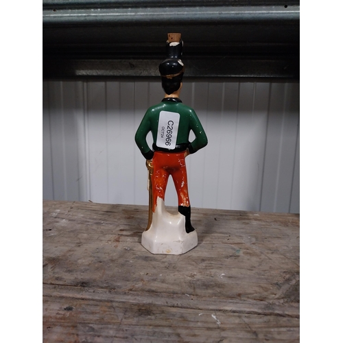 724 - Irish Mist ceramic advertising figure. {27 cm H x 4 cm Dia}.