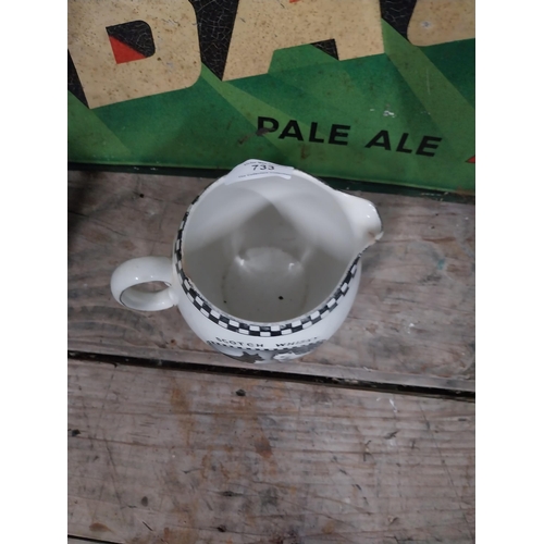 733 - Black and White Label Whiskey Shellyware ceramic water jug. {11 cm H x 15 cm W x 12 cm W}.