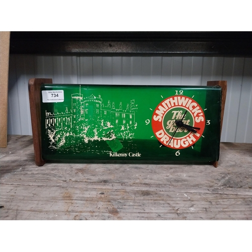 734 - 1970's Smithwick Draught perspex and wood battery operated advertising wall clock. {15 cm H x 34 cm ... 