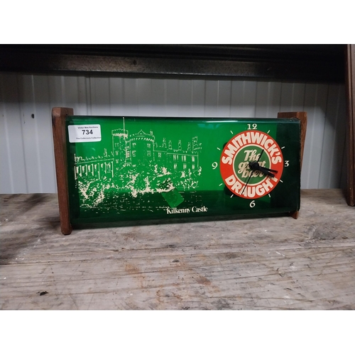 734 - 1970's Smithwick Draught perspex and wood battery operated advertising wall clock. {15 cm H x 34 cm ... 