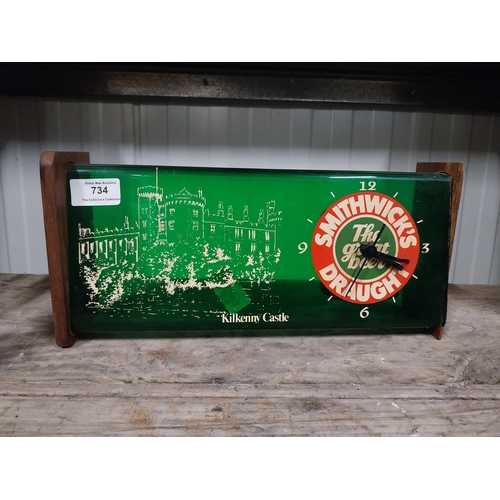 734 - 1970's Smithwick Draught perspex and wood battery operated advertising wall clock. {15 cm H x 34 cm ... 