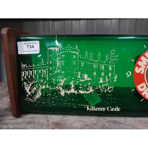 734 - 1970's Smithwick Draught perspex and wood battery operated advertising wall clock. {15 cm H x 34 cm ... 