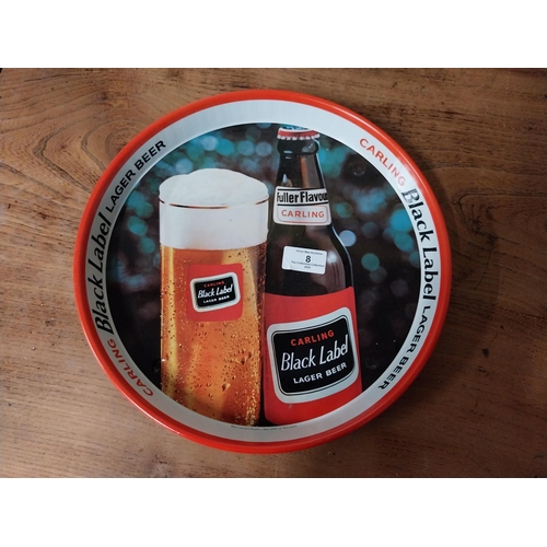 8 - Black Label tin plate advertising tray. {3 cm H x 30 cm Dia.}.