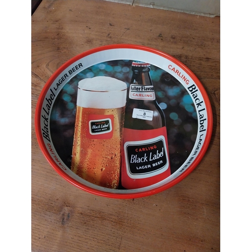 8 - Black Label tin plate advertising tray. {3 cm H x 30 cm Dia.}.