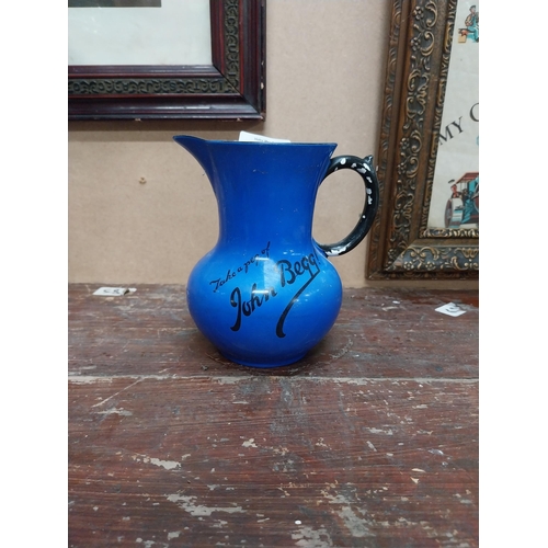 91 - Take a peg of John Begg ceramic advertising water jug {25 cm H x 13 cm Diam.}.