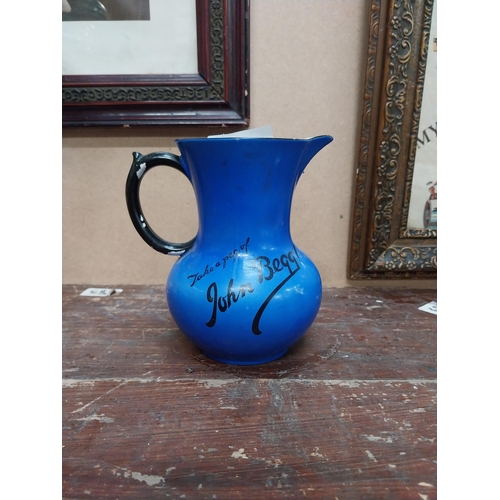 91 - Take a peg of John Begg ceramic advertising water jug {25 cm H x 13 cm Diam.}.