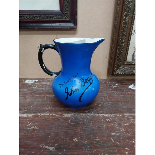 91 - Take a peg of John Begg ceramic advertising water jug {25 cm H x 13 cm Diam.}.