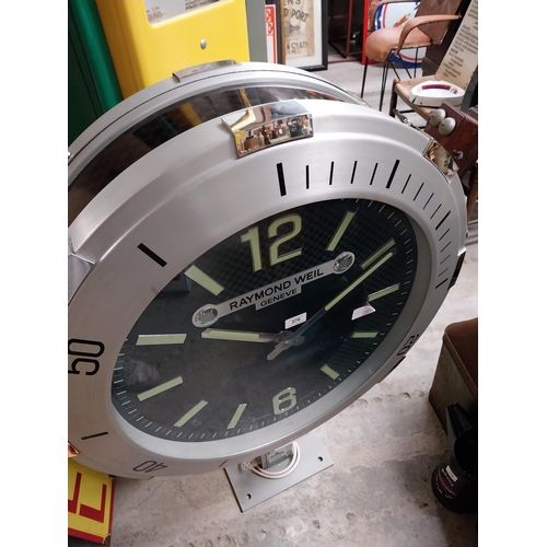 832 - Raymond Weil Shop display advertising clock on stand. {110 cm H x 90 cm W x 27 cm D}.