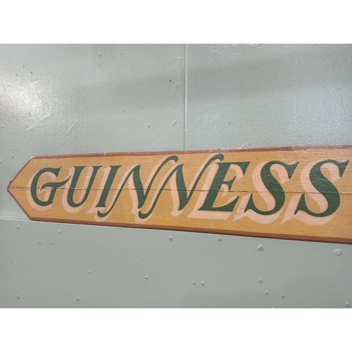 719 - Guinness Genuine Irish Stout painted wooden advertising board  H 17cm x W 160cm