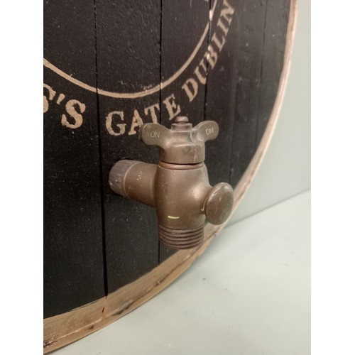 717 - Guinness Extra Stout brass strapped barrel end with tap  Dia 60cm . NOT AVAILABLE TO VIEW IN PERSON.