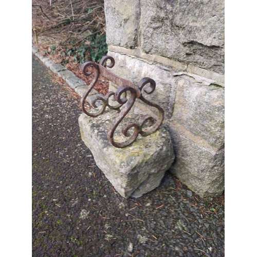 1 - 19th C. Wrought iron scraper on limestone base. {35 cm H x 32 cm W x 18 cm D}.