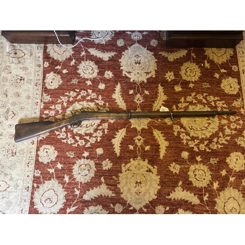 101 - 1872 percussion capped rifle. {137 cm L x 12 cm H}.