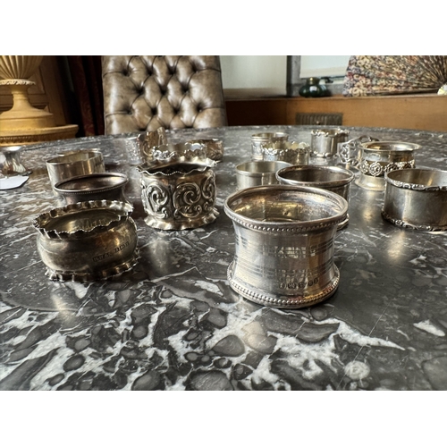 1028 - Collection of eighteen  English silver napkin rings. Hallmarked in Birmingham { 13 }, Sheffield { 2 ... 