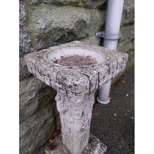 1051 - Weathered composition bird bath. {77 cm H x 34 cm W x 34 cm D}.