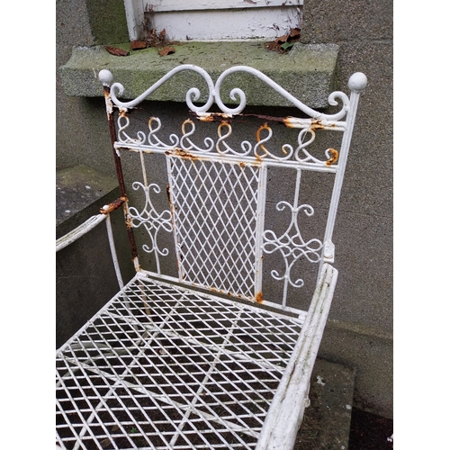 1052 - Wrought iron garden armchair. {94 cm H x 56 cm W x 55 cm D}.