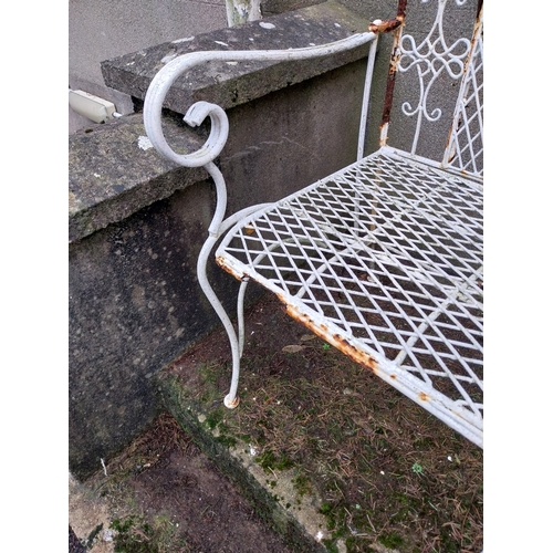 1052 - Wrought iron garden armchair. {94 cm H x 56 cm W x 55 cm D}.