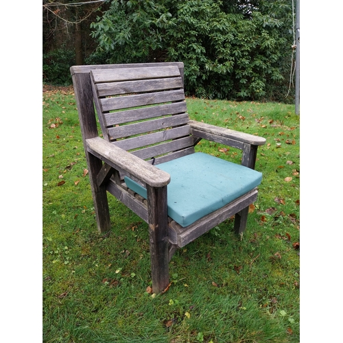 1054 - Pair of vintage teak garden chairs with green cushions. {92 cm H x 67 cm W x 66 cm D}.