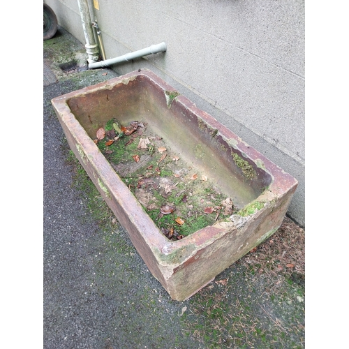 1055 - Salt glazed terracotta trough. {43 cm H x 137 cm W x 71 cm D}.