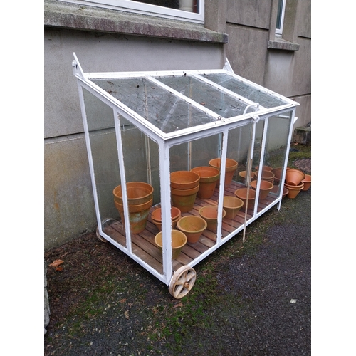 1056 - Good quality wrought iron portable mini greenhouse on wheels with lift up lid. {107 cm H x 123 cm W ... 