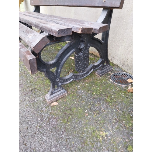 1063 - Early 20th C. Cast iron garden bench with wooden laths. {81 cm H x 153 cm W x 67 cm D}.