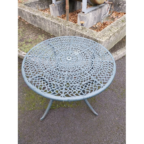 1065 - Cast alloy garden table with damage. {71 cm H x 108 cm Dia.}.