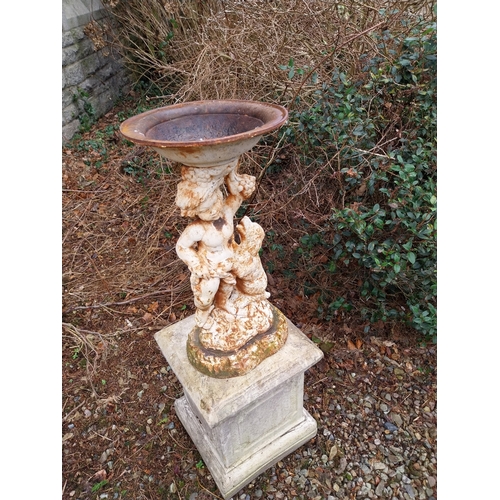 1074 - Cast iron bird bath on composition stand. {114 cm H x 39 cm W x 39 cm D}.