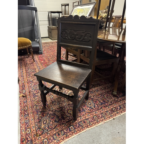 1091 - 18th. C. carved oak hall chair. { 95cm H X 48cm W X 41cm D }.