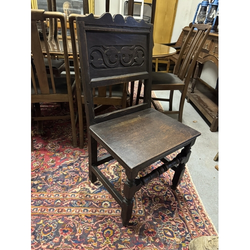 1091 - 18th. C. carved oak hall chair. { 95cm H X 48cm W X 41cm D }.