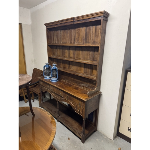 1093 - 1920's oak Welsh dresser, the super structure with three shelves above ten spice drawers over three ... 