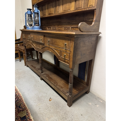 1093 - 1920's oak Welsh dresser, the super structure with three shelves above ten spice drawers over three ... 