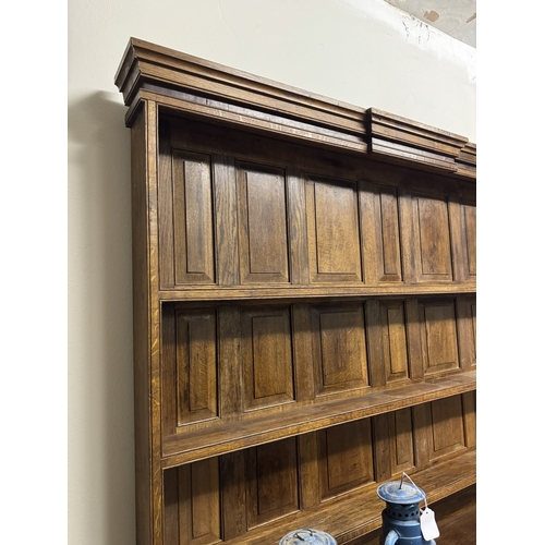 1093 - 1920's oak Welsh dresser, the super structure with three shelves above ten spice drawers over three ... 