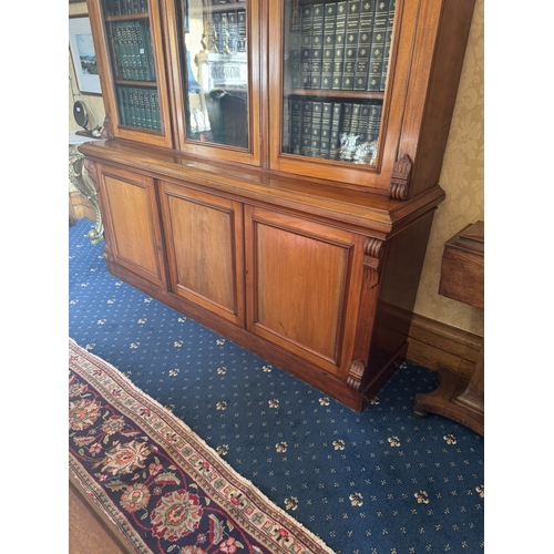 115 - Victorian mahogany three door bookcase with three glazed doors above three blind doors. {245 cm H x ... 