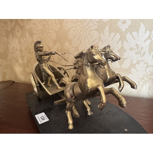 124 - Early 20th C. Gilded Metal Roman Chariot mounted on wooden plinth. [21 xm H x 40 cm W x 19 cm D}.