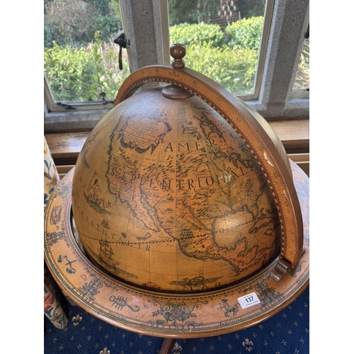 137 - Mahogany world globe drink's cabinet in the Regency style. {124 cm H x 74 cm Dia.{.