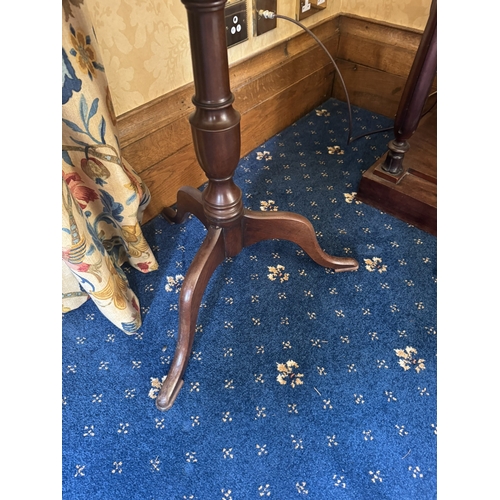 139 - Edwardian mahogany wine table raised on turned column with three outswept legs. {68 cm H x 49 cm Dia... 