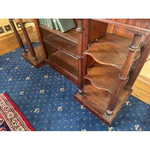 143 - William IV mahogany open floor bookcase raised on reeded columns and platform base. {93 cm H x 155 c... 