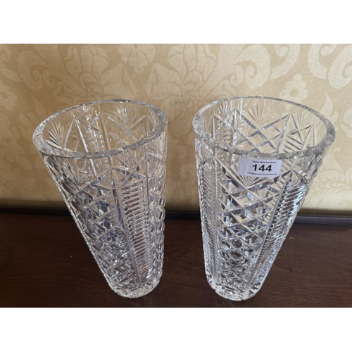 144 - Pair of Waterford cut crystal flower vases. {30 cm H x 15 cm Dia.}.